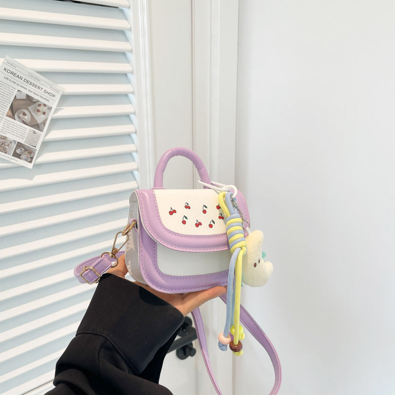 Women's mini handbag with cheerful cherry design and charming pendants