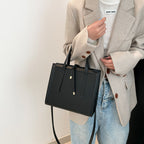 Women's elegant handbag in minimalist design with detachable shoulder strap