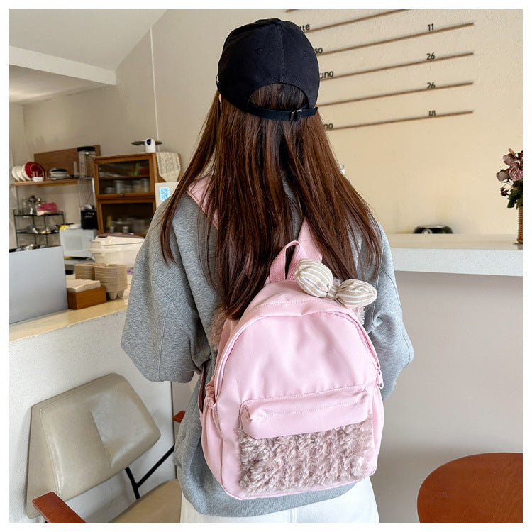 Plush backpack with high-quality surface structure
