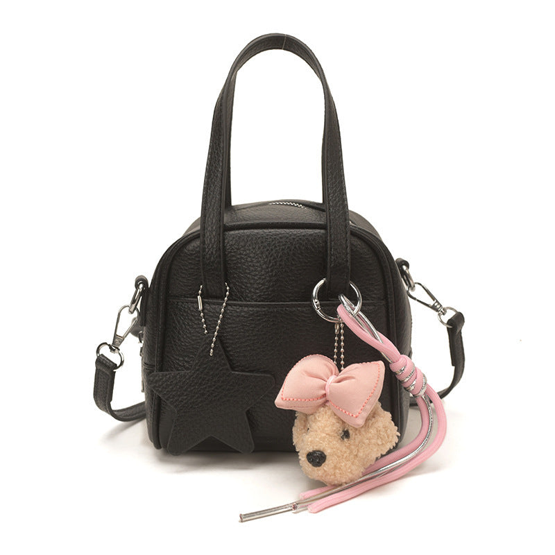 Ladies mini bag with decorative pendant