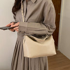 Women's handbag with flexible strap and elegant design