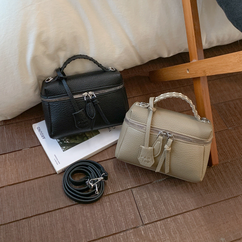Women's mini handbag with fine decorative seams and detachable shoulder strap