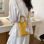 Ladies mini handbag with elegant pendant