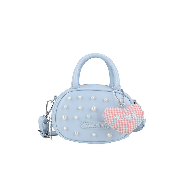 Ladies trendy mini handbag with striking pearl applications