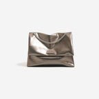 Women's clutch bag made of shiny synthetic leather with decorative chain strap