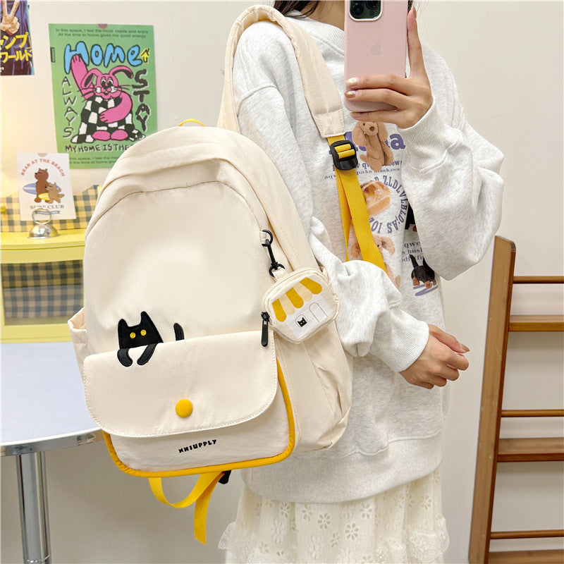 Playful backpack with cat design and versatile compartments
