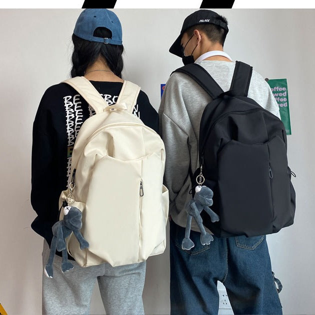 Backpack with Versatile Compartments and Charming Pendant