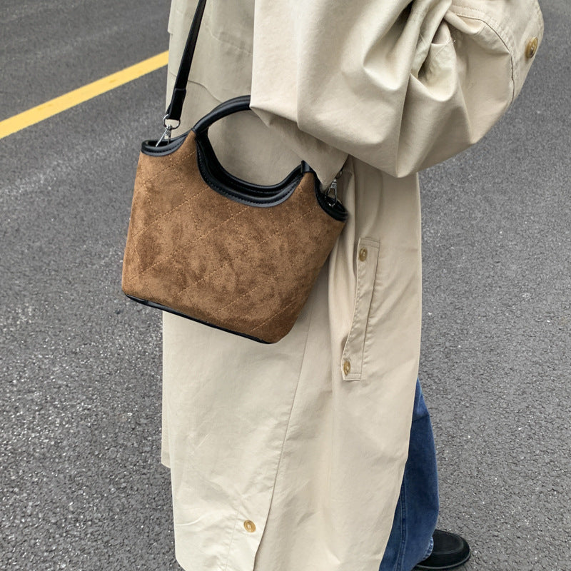 Ladies elegant handbag with high-quality suede and leather accents