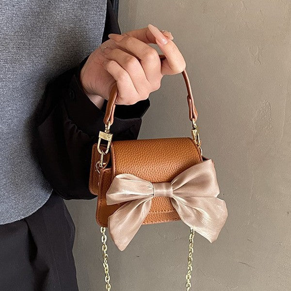Ladies mini handbag with decorative bow design