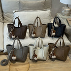 Women's mini handbag in an elegant design with charming pendant