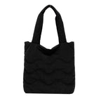 Padded shoulder bag with wave design