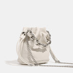 Women's mini backpack bag with elegant chain handle and fine texture