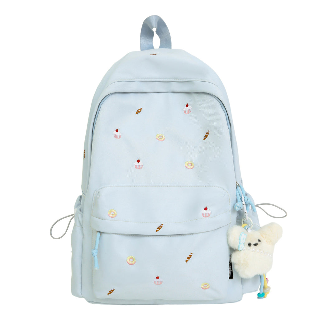 Playful backpack with unique back pattern appliqués
