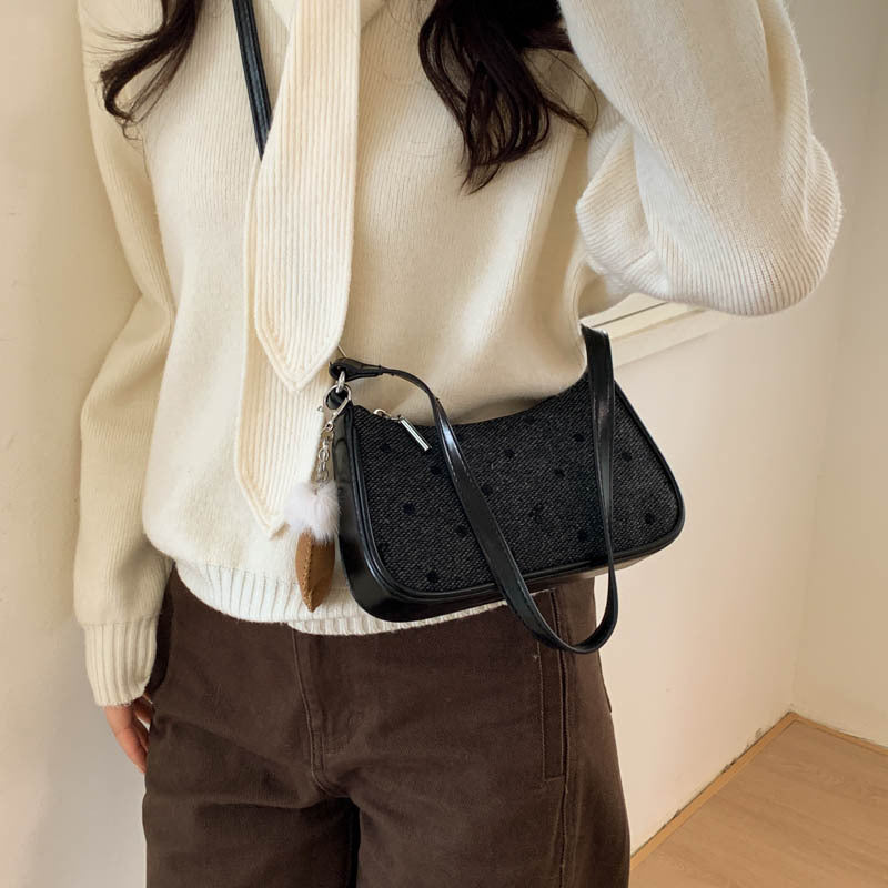 Ladies trendy mini handbag with playful animal charm