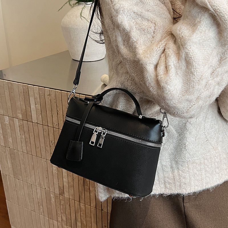 Women's mini shoulder bag with practical compartments