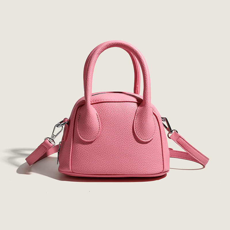 Women's mini handbag with structured exterior and detachable shoulder strap