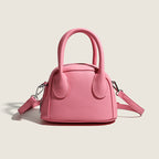 Women's mini handbag with structured exterior and detachable shoulder strap