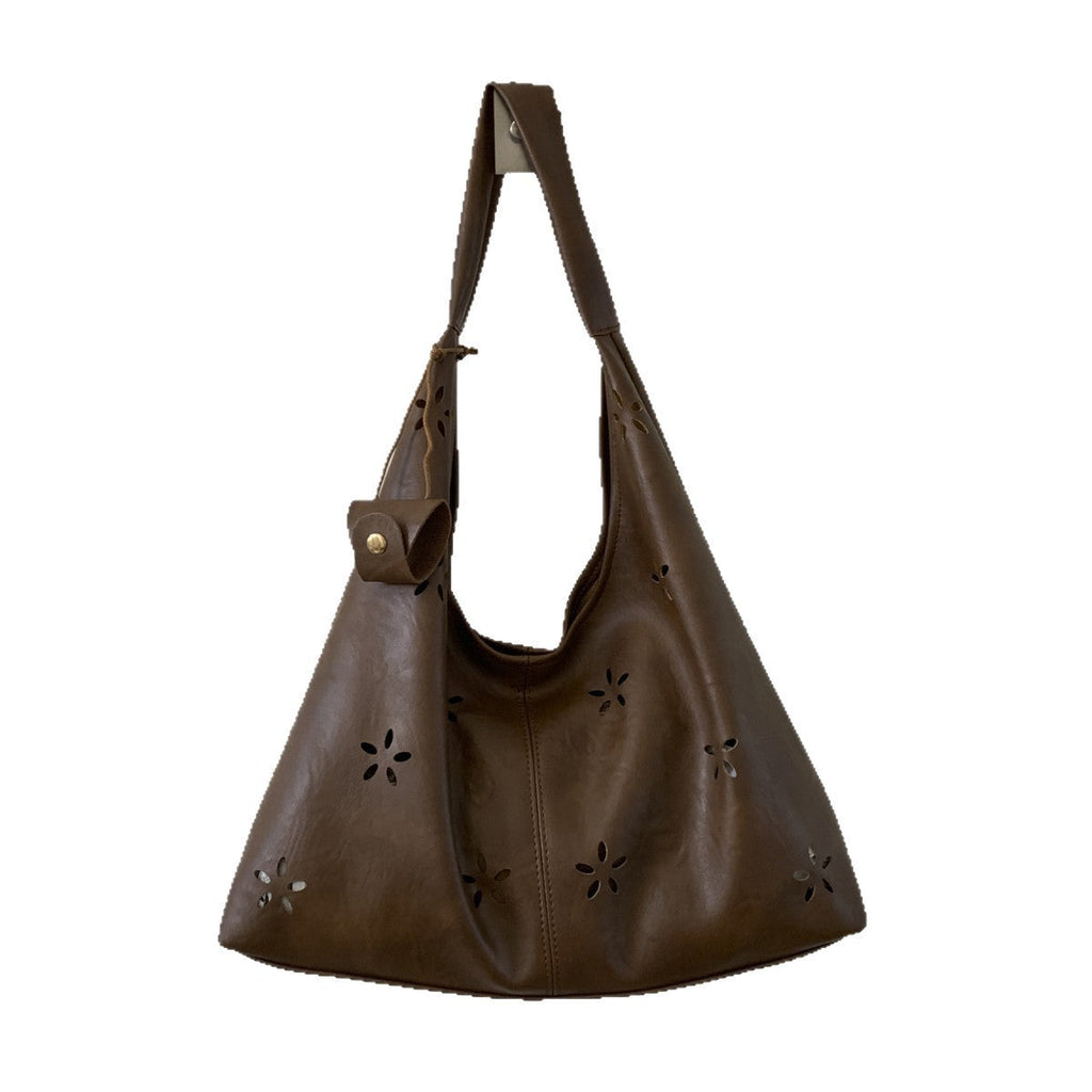 Women's hobo bag with floral design and practical mini organizer