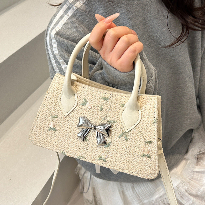 Ladies mini bag with floral woven design and stylish bow detail
