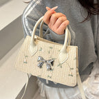 Ladies mini bag with floral woven design and stylish bow detail