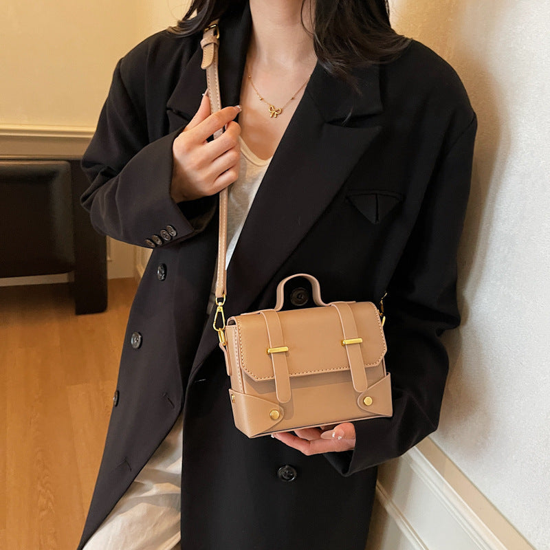 Women's mini handbag with textured design and detachable shoulder strap