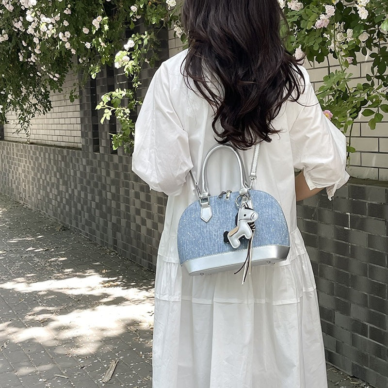Women's mini handbag with animal charm and fashionable denim