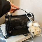 Women elegant mini handbag with cute pendant