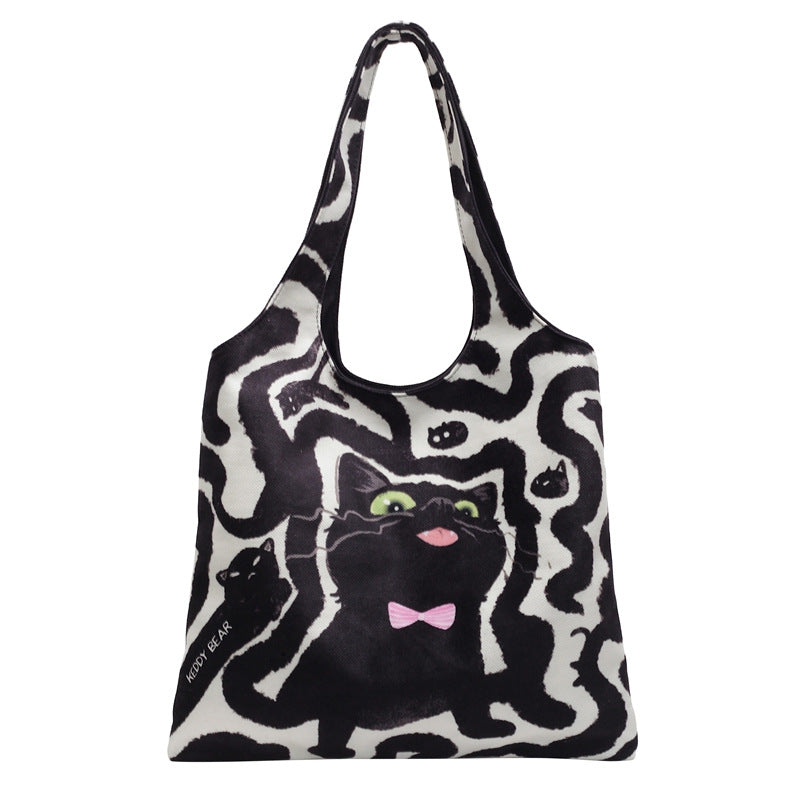 Shoulder bag with playful cat motif