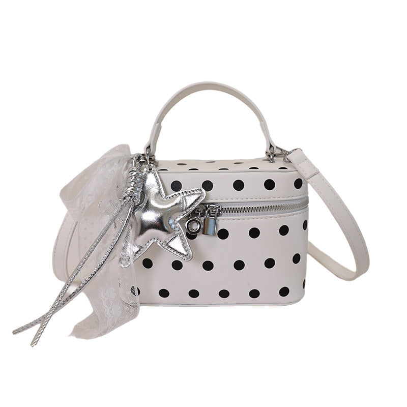 Women's mini handbag with playful design and elegant accents