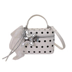 Women's mini handbag with playful design and elegant accents