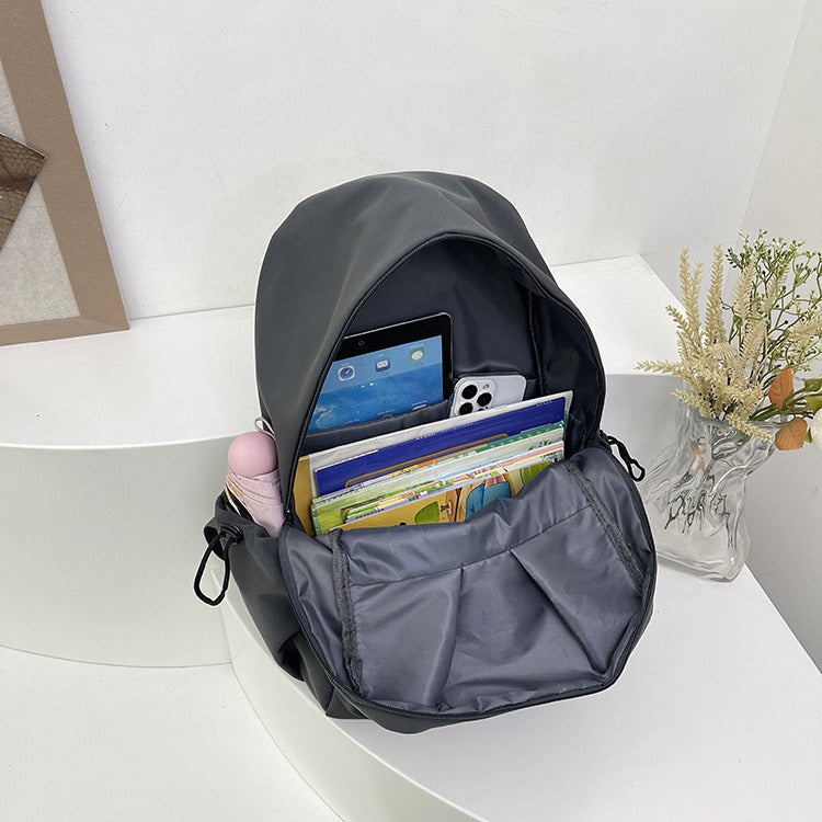 Backpack with Versatile Compartments and Charming Pendant