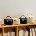 Women's mini handbag with gold chain accent and textured design