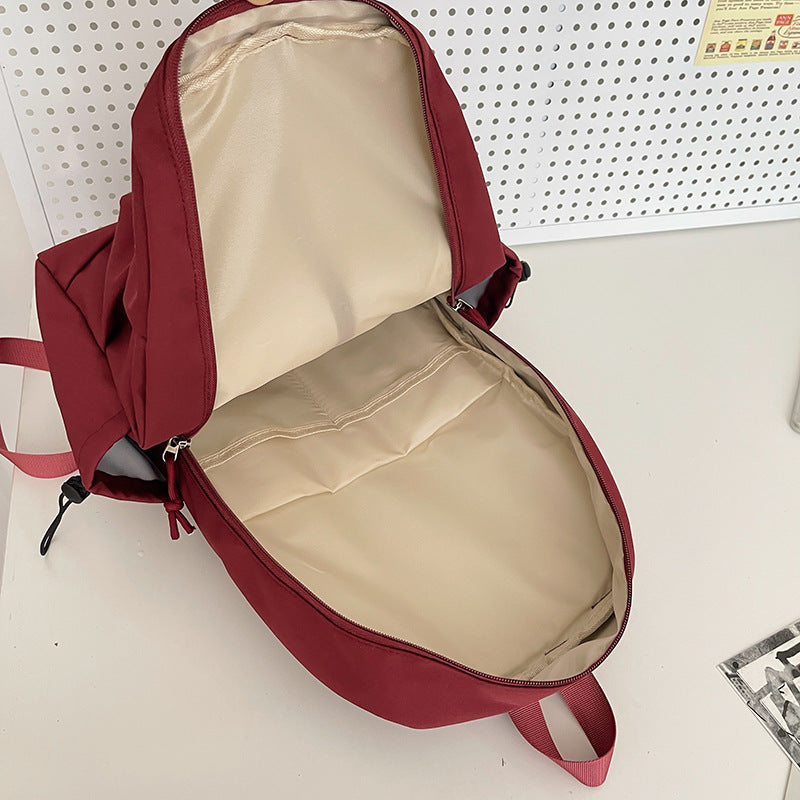 Lightweight urban backpack with multifunctional side pockets