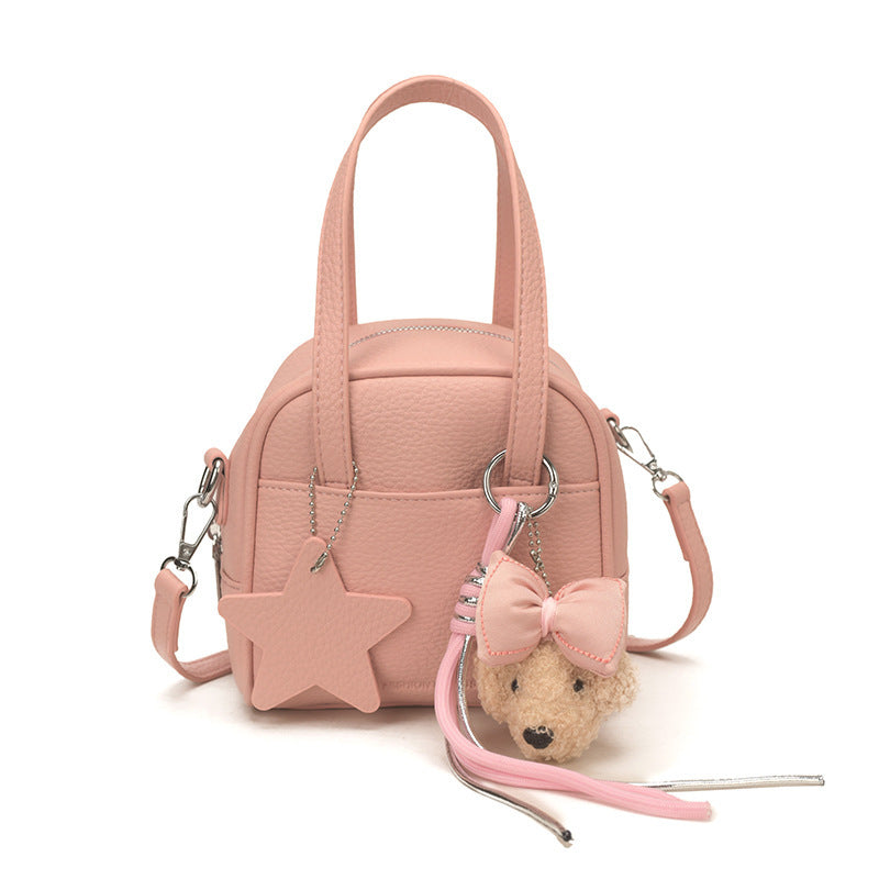 Ladies mini bag with decorative pendant