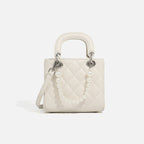 Ladies mini handbag with pearl-embellished chain and quilted design