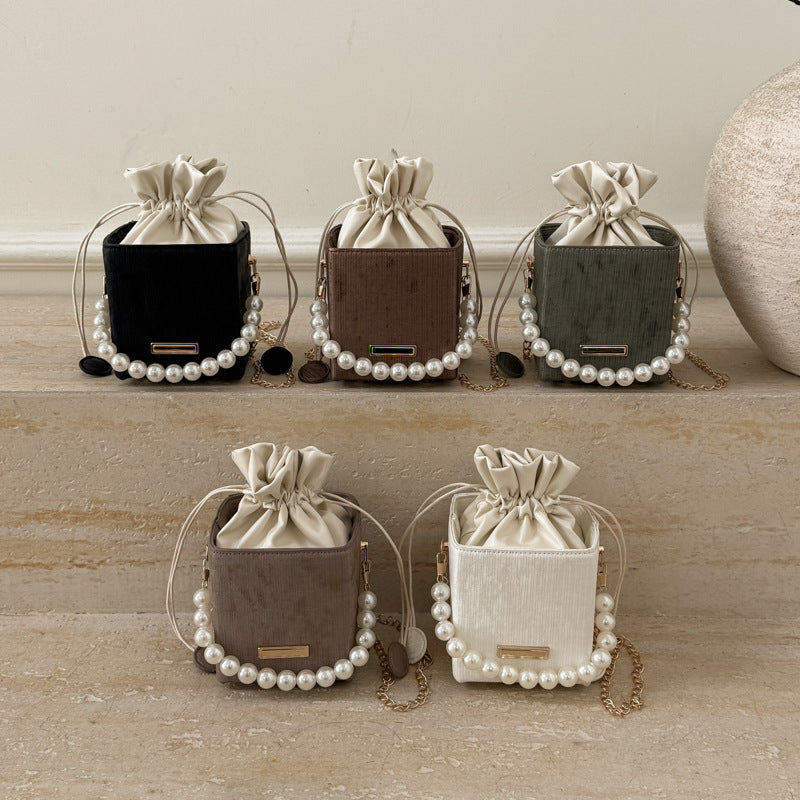 Ladies stylish mini handbag with drawstring and pearl accent