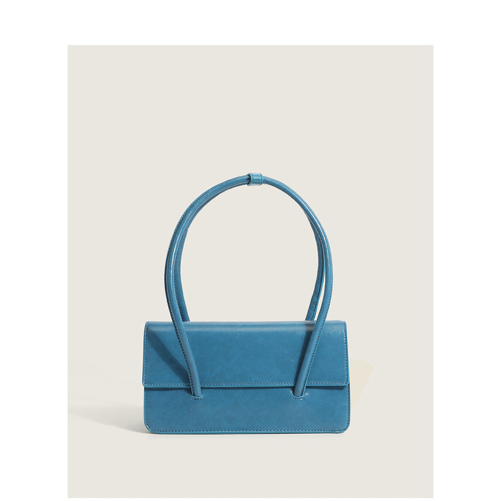 Ladies elegant handbag with minimalist silhouette