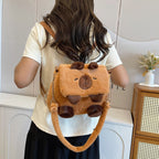 Plush shoulder bag with animal motif and shoulder strap