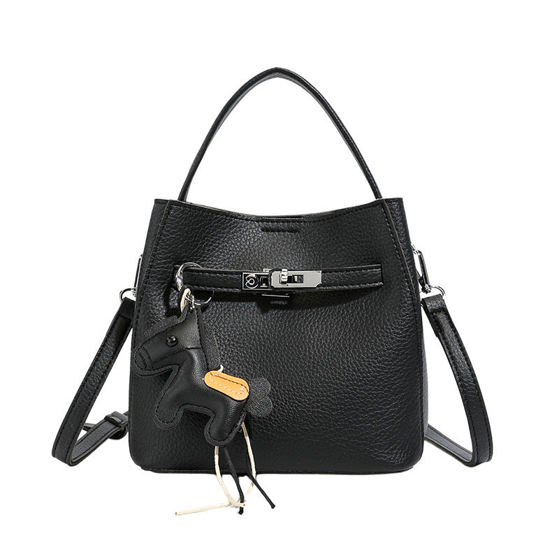 Women’s mini crossbody bag with playful design and cute charm