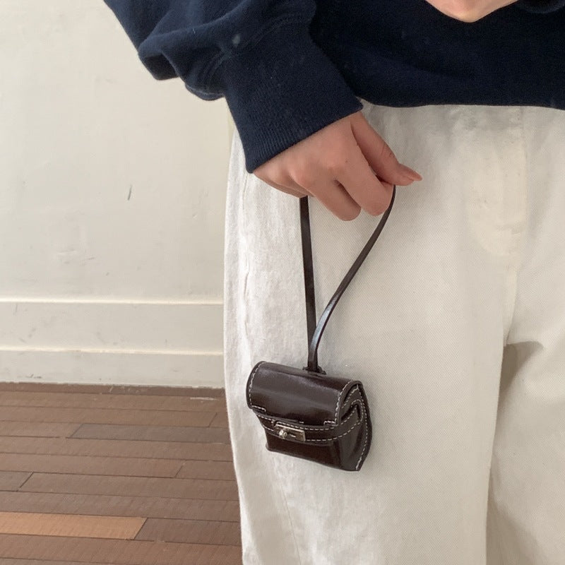 Ladies mini handbag made of high-quality artificial leather with playful closure