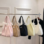 Leisure bag with structured design and playful scarf