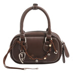 Women's mini handbag with playful drawstring and elegant accents