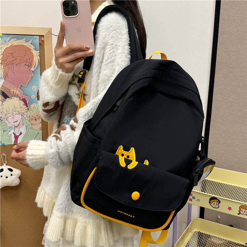 Playful backpack with cat design and versatile compartments