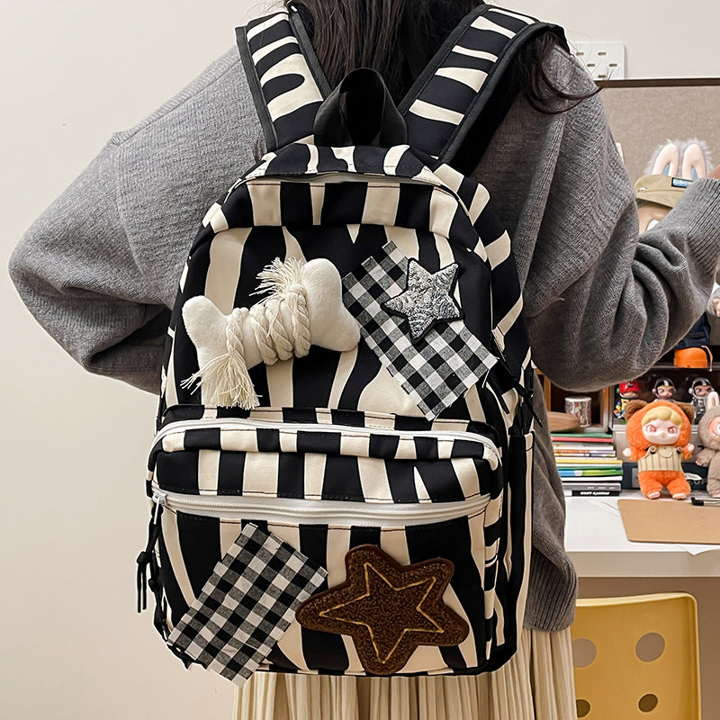 Backpack with Creative Applications and Practical Compartments