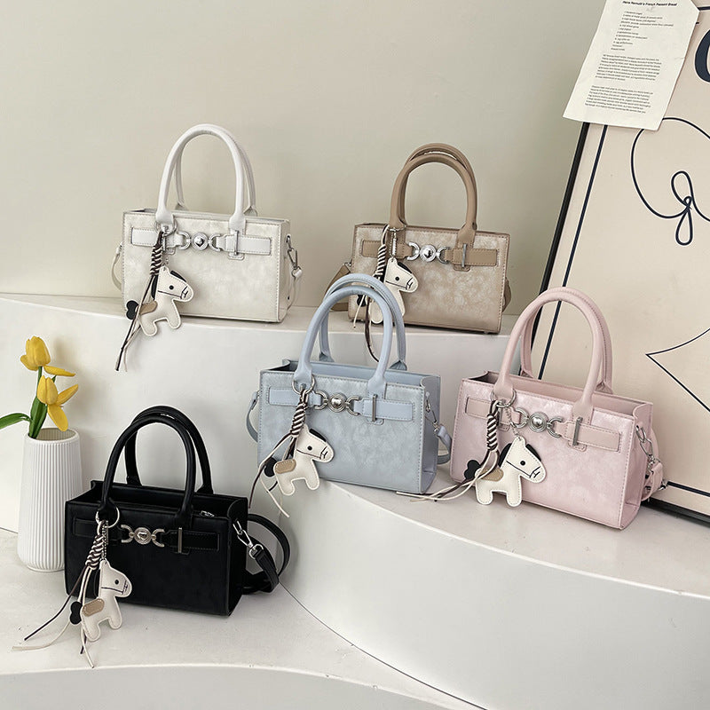 Women's handbag in modern minimalist style with playful charm