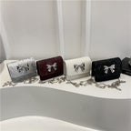 Women's clutch with playful bow design