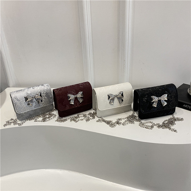 Women's clutch with playful bow design