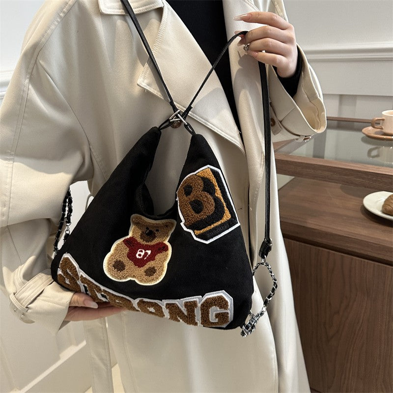 Shoulder bag in playful bear pattern