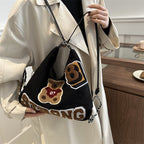 Shoulder bag in playful bear pattern