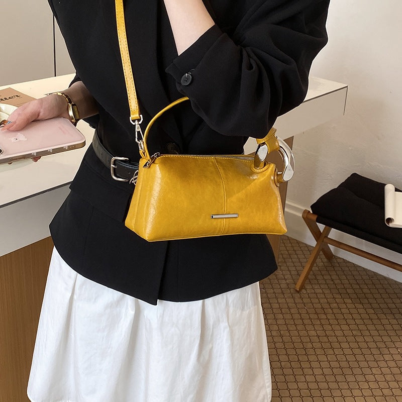 Ladies elegant handbag with minimalist design and noble accents